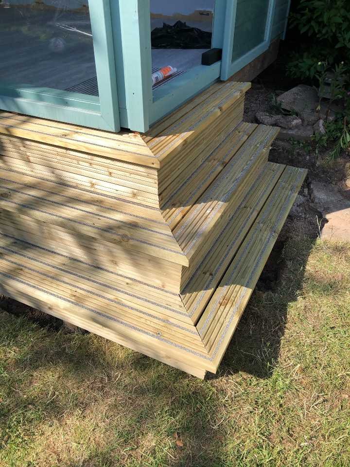 Expert Kitchen fitting and outside space contractors. Decking steps leading to outside bar